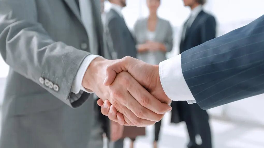 ELERA Logistics team shaking hands with a client